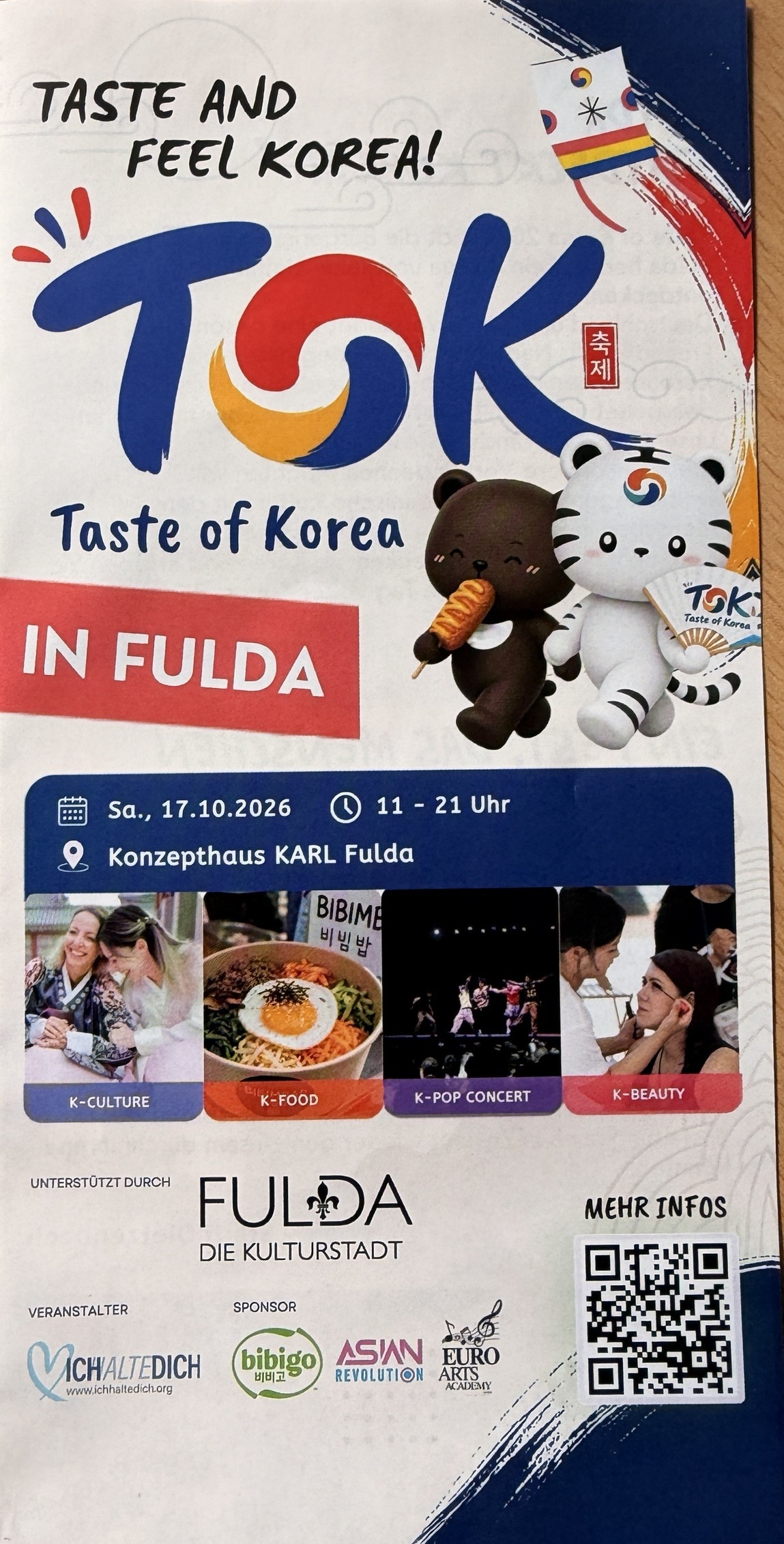 Flyer Taste of Korea in Fulda am Samstag, 17.10.2026, 11 bis 21 Uhr im Konzepthaus KARL, mit TOK-Logo, Bär- und Tiger-Maskottchen sowie Bildern zu K-Culture, K-Food, K-Pop Concert und K-Beauty